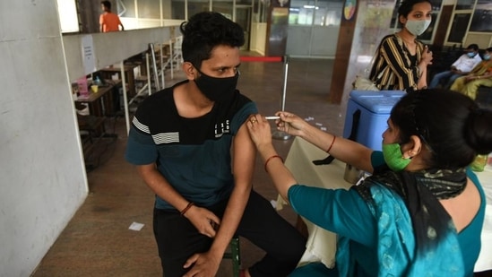 A person gets a dose of Covid-19 vaccine at the district hospital in Noida’s Sector 30 on Sunday.&nbsp;((Sunil Ghosh /HT))