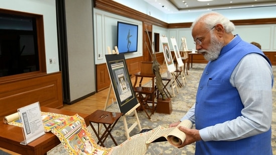 Prime Minister Narendra Modi inspects antiquities that have returned from Australia, in New Delhi, Monday. (ANI)