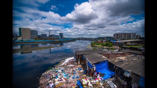 One of the primary challenges of this project is that there are slums along the bank of the river. We will have to arrange rehabilitation for them which is why the timeline for the completion of this project is a bit longer. (Pratik Chorge/HT PHOTO) One of the primary challenges of this project is that there are slums along the bank of the river. We will have to arrange rehabilitation for them which is why the timeline for the completion of this project is a bit longer. (Pratik Chorge/HT PHOTO)