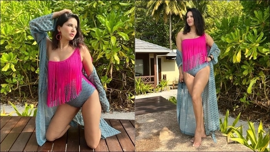 In another set of photos shared on her Instagram handle, Sunny Leone can be seen in a pink and blue monokini teamed with an easy-breezy cape.(Instagram/sunnyleone)