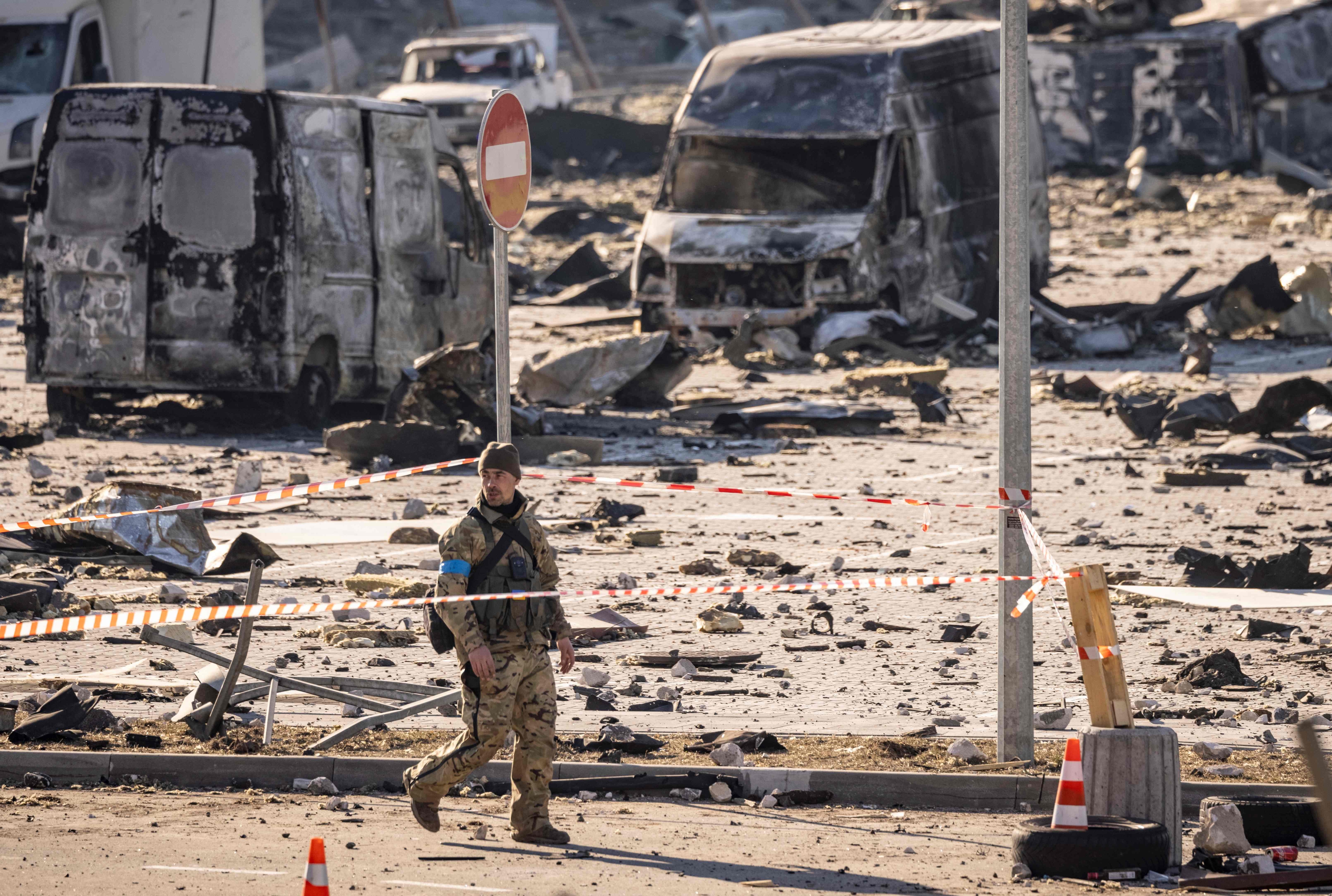 A Ukranian serviceman walks amid the rubble of the Retroville shopping mall, a day after it was shelled by Russian forces in a residential district in Kyiv. (AFP) A Ukranian serviceman walks amid the rubble of the Retroville shopping mall, a day after it was shelled by Russian forces in a residential district in Kyiv. (AFP)