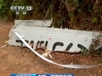 In this image taken from video footage run by China's CCTV, police tape cordons off debris at the site of a plane crash in southern China's Guangxi Zhuang Autonomous Region, Tuesday, March 22, 2022. AP/PTI(AP03_22_2022_000111A)
