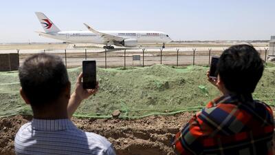 Residents watch as a China Eastern passenger jet prepares to take off on a test flight from the new Beijing Daxing International Airport on Monday, May 13, 2019. State media are reporting a Chinese airliner from China Eastern with 133 people on board crashed in the southern province of Guangxi on Monday, sparking a mountainside fire. (AP/FILE) Residents watch as a China Eastern passenger jet prepares to take off on a test flight from the new Beijing Daxing International Airport on Monday, May 13, 2019. State media are reporting a Chinese airliner from China Eastern with 133 people on board crashed in the southern province of Guangxi on Monday, sparking a mountainside fire. (AP/FILE)
