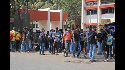 Students are seen outside PICT college, Dhankawdi, on Tuesday. (Ravindra Joshi/HT PHOTO)