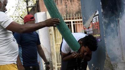 A man drinks water from a pipe outside the municipal corporation office in Ghaziabad. In a survey last year, the civic body found that 63 of 100 residential wards do not receive enough water. (Sakib Ali/HT Photo) A man drinks water from a pipe outside the municipal corporation office in Ghaziabad. In a survey last year, the civic body found that 63 of 100 residential wards do not receive enough water. (Sakib Ali/HT Photo)