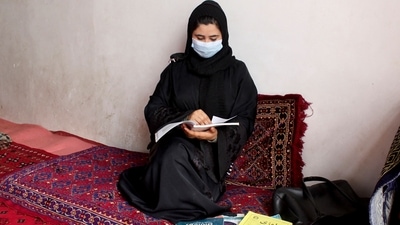School girl Raihana studies at a home in Kunduz province. (AFP) School girl Raihana studies at a home in Kunduz province. (AFP)