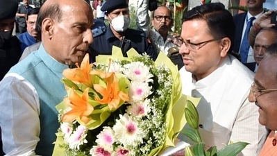 Dehradun, Mar 21 (ANI): Pushkar Singh Dhami felicitates Defence Minister Rajnath Singh on his arrival, in Dehradun on Monday. (ANI Photo) (ANI)