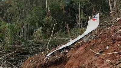 Debris of a Chinese passenger plane that was carrying 132 people when it crashed in China's Guangxi province on Monday. (Credit: @CGTNOfficial) (@CGTNOfficial)