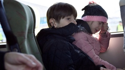 Children sit on a bus bound for Germany after fleeing from Mariupol in Ukraine.&nbsp; (REUTERS)