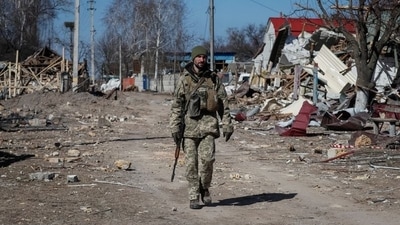 A Ukrainian service member walks, as the Russian invasion continues, in a destroyed village on the front line in the east Kyiv region, Ukraine / Representational&nbsp; (REUTERS)