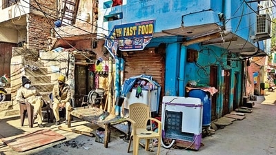 Police in Kasturba Nagar, near the spot of the incident. (HT Photo) Police in Kasturba Nagar, near the spot of the incident. (HT Photo)