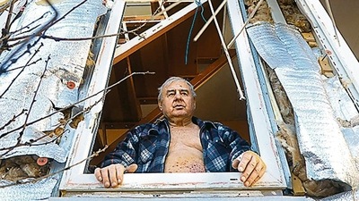 A man looks out of the window of his partially destroyed house after the shelling by Russia, on the outskirts of Odessa. AFP A man looks out of the window of his partially destroyed house after the shelling by Russia, on the outskirts of Odessa. AFP