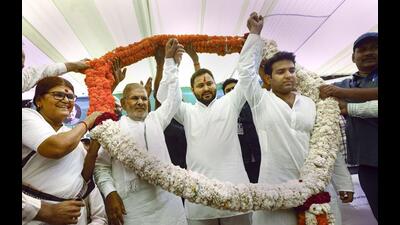 LJD leader Sharad Yadav with RJD’s Tejashwi Yadav in New Delhi on Sunday. (PTI) LJD leader Sharad Yadav with RJD’s Tejashwi Yadav in New Delhi on Sunday. (PTI)