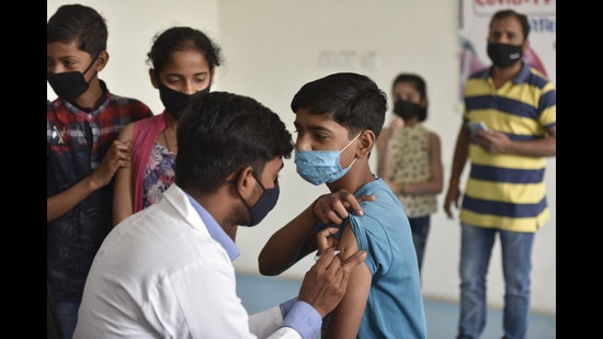 A student receives a dose of a Covid vaccine in Noida. (HT photo/Sunil Ghosh)