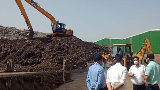 MC Commissioner Pardeep Sabharwal along with other officials inspecting the main dump site of MC at Tajpur road, where windrow composting has to commence, in Ludhiana on March 22, 2022. (HT PHOTO)