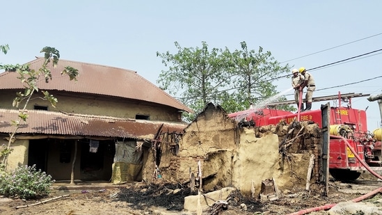 Birbhum, Mar 22 (ANI): Firemen douse the fire at the incident site where several houses were allegedly set on fire leaving eight people dead, at Rampurhat, in Birbhum on Tuesday. (ANI Photo)(Shyamal Maitra)