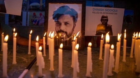 Journalists in New Delhi light candles and pay tribute to Reuters photographer Danish Siddiqui.&nbsp;(AP file)