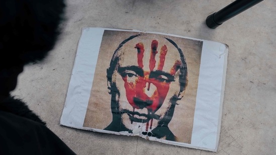 This photograph taken in Belgrade on March 20, 2022 shows a placard depicting Russian President Vladimir Putin during a rally against Russia's military invasion on Ukraine. (Photo by Vladimir Zivojinovic / AFP) (AFP)