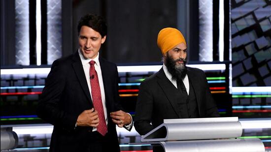 Liberal Leader Justin Trudeau (left) and NDP Leader Jagmeet Singh take part in the federal election English-language Leaders debate in Gatineau, Canada, on September 9, 2021. (REUTERS)