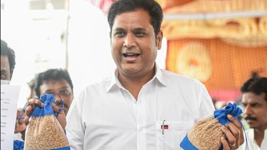 DMK MLA T.R.B. Rajaa shows a rare type of paddy as he arrives to attend the Tamil Nadu Agriculture Budget session for financial year 2022-23, at Fort St George, in Chennai, on Saturday. (PTI)