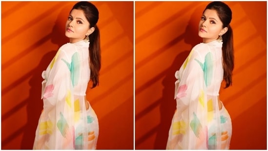 Rubina chose a white chiffon saree, a perfect pick for the summer season. If you are searching for minimal ethnic looks to upgrade your wardrobe, take tips from the star. Her pristine white look with its splash of colours is an ideal option for the modern woman.(Instagram/@rubinadilaik)