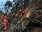Rescuers conduct search operations at the site of a plane crash in Tengxian County in southern China's Guangxi Zhuang Autonomous Region. Rescuers conduct search operations at the site of a plane crash in Tengxian County in southern China's Guangxi Zhuang Autonomous Region.