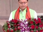 Pushkar Singh Dhami taking oath as chief minister of Uttarakhand in Dehradun.