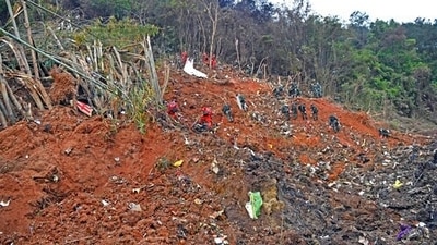 In this photo released by Xinhua News Agency, rescue workers search for the black boxes at a plane crash site in southwestern China's Guangxi Zhuang Autonomous Region, Tuesday, March 22, 2022. (Zhou Hua/Xinhua via AP) (AP) In this photo released by Xinhua News Agency, rescue workers search for the black boxes at a plane crash site in southwestern China's Guangxi Zhuang Autonomous Region, Tuesday, March 22, 2022. (Zhou Hua/Xinhua via AP) (AP)
