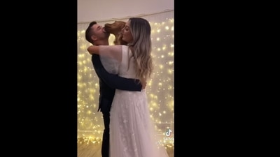 A screengrab of the video of a couple dancing at their wedding ceremony along with their dog. &nbsp; (goldenretriever_lilly/Instagram)