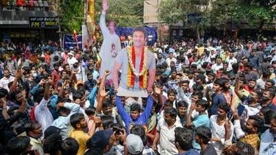 Fans of late Kannada actor Puneeth Rajkumar hold a cut-out of the star on the occasion of his 47th birth anniversary and the worldwide release of his last action thriller film 'James' in Bangalore on March 17, 2022. (Photo by Manjunath Kiran / AFP) (AFP) Fans of late Kannada actor Puneeth Rajkumar hold a cut-out of the star on the occasion of his 47th birth anniversary and the worldwide release of his last action thriller film 'James' in Bangalore on March 17, 2022. (Photo by Manjunath Kiran / AFP) (AFP)