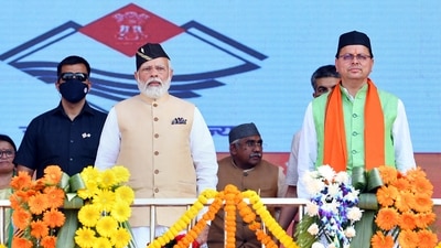 Prime Minister Narendra Modi with Uttarakhand Governor Lt. General (retd.) Gurmit Singh and Uttarakhand CM Pushkar Singh Dhami, during the oath taking ceremony of Dhami, in Dehradun. (PTI) Prime Minister Narendra Modi with Uttarakhand Governor Lt. General (retd.) Gurmit Singh and Uttarakhand CM Pushkar Singh Dhami, during the oath taking ceremony of Dhami, in Dehradun. (PTI)
