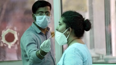 A health worker collects swab samples for Covid-19 test at the district hospital in Noida’s Sector 30 on Saturday. (Sunil Ghosh /HT) A health worker collects swab samples for Covid-19 test at the district hospital in Noida’s Sector 30 on Saturday. (Sunil Ghosh /HT)
