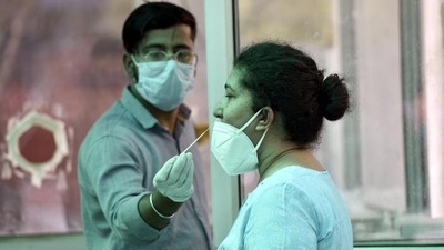 A health worker collects swab samples for Covid-19 test,