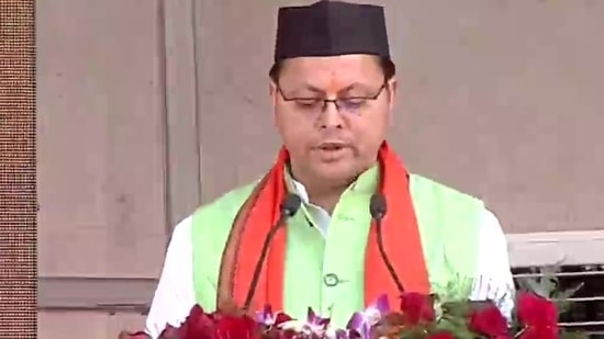 Pushkar Singh Dhami taking oath as chief minister of Uttarakhand in Dehradun.(ANI )