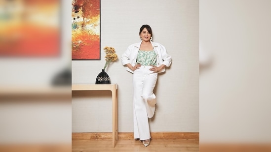Madhuri Dixit teamed her look with a pair of white pointed pumps with golden accessories in the toes.(Instagram/@madhuridixitnene)
