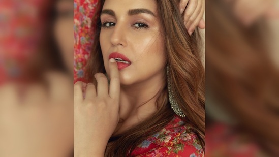 Huma Qureshi wore long oxidised earrings that complemented her overall look really well and opted for soft peachy eyes and bold red lips.(Instagram/@iamhumaq)
