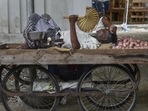 A vegetable seller takes rest on cart as the Chennai city. PTI A vegetable seller takes rest on cart as the Chennai city. PTI