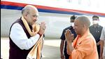 Union home minister Amit Shah and chief minister Yogi Adityanath greeting each other at the Lucknow airport on Thursday. (ANI PHOTO) Union home minister Amit Shah and chief minister Yogi Adityanath greeting each other at the Lucknow airport on Thursday. (ANI PHOTO)