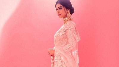 Pulling back her silky tresses into a mid-parted low bun, Mouni accessorised her look with a pair of gold earrings, a statement layered choker and finger rings all from Tyaani Fine Jewellery. (Instagram/imouniroy ) Pulling back her silky tresses into a mid-parted low bun, Mouni accessorised her look with a pair of gold earrings, a statement layered choker and finger rings all from Tyaani Fine Jewellery. (Instagram/imouniroy )