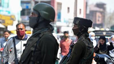Paramilitary troopers stand guard along a street in Srinagar. J&K police warned people providing shelter to terrorists or their associates. (AFP) Paramilitary troopers stand guard along a street in Srinagar. J&K police warned people providing shelter to terrorists or their associates. (AFP)