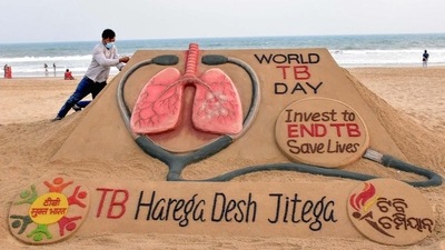 Sand artist Sudarshan Pattnaik makes a sculpture on World Tuberculosis Day. (PTI Photo) Sand artist Sudarshan Pattnaik makes a sculpture on World Tuberculosis Day. (PTI Photo)