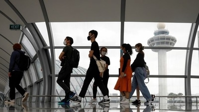 People pass the control tower of Singapore's Changi Airport, Singapore.&nbsp; (REUTERS file photo)