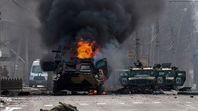 A file photo of a Russian armored personnel carrier burning amid damaged and abandoned light utility vehicles after fighting in Kharkiv, Ukraine (AP) A file photo of a Russian armored personnel carrier burning amid damaged and abandoned light utility vehicles after fighting in Kharkiv, Ukraine (AP)