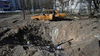 A shell crater in seen at a residential area amid Russia's attack on Ukraine, in Sievierodonetsk, Luhansk region (Reuters)