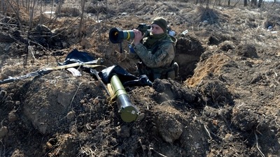 A serviceman of Ukrainian military forces holds a FGM-148 Javelin, an American-made portable anti-tank missile. (AFP)