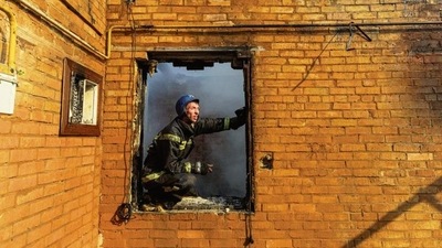 A firefighter at a residential building damaged in shelling in Kyiv on Wednesday. REUTERS A firefighter at a residential building damaged in shelling in Kyiv on Wednesday. REUTERS