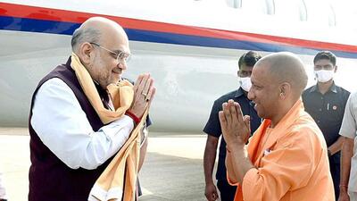 Union home minister Amit Shah and chief minister Yogi Adityanath greeting each other at the Lucknow airport on Thursday. (ANI PHOTO) Union home minister Amit Shah and chief minister Yogi Adityanath greeting each other at the Lucknow airport on Thursday. (ANI PHOTO)