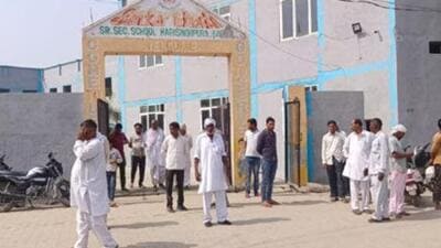 Villagers gathered outside the private school in Harisinghpura village in Karnal district of Haryana, where a Class 12 student was stabbed to death by his classmate. (HT Photo)