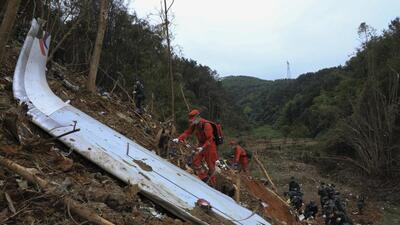 Emergency workers at the China Eastern flight crash site in Tengxian County in southern China’s Guangxi Zhuang Autonomous Region. (AP)