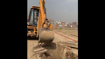 Illegal colonies were demolished by GLADA in villages on Rahon Road in Ludhiana on March 24, 2022. (HT PHOTO)